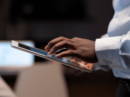 Image of a man making a purchase on a tablet